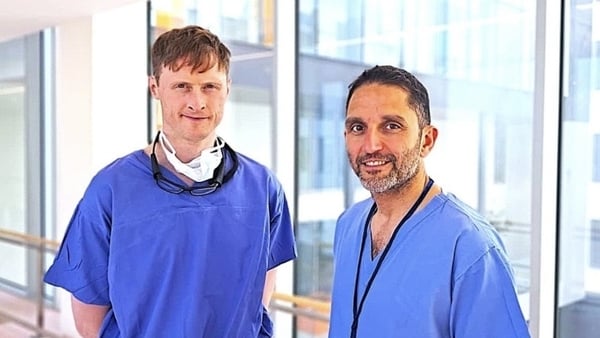 a photograph of dr cormac o'connor (L) and dr samer arnous both wearing blue medical scrubs
