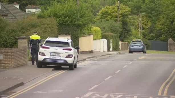 Two garda cars on the road