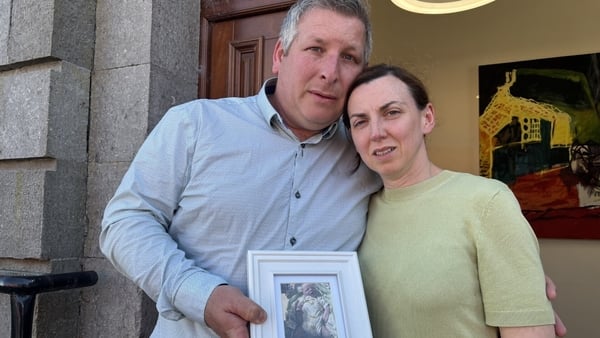 Marion and Robert Hunt with a photograph of Amelia Rose - pic - RTE