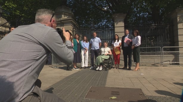 People stand outside Leinster House 