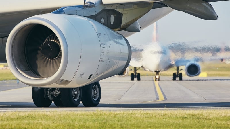 Hot air from jet engine against airplane taxiing to airport runway.