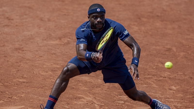 Frances Tiafoe returns the ball against Hubert Hurkacz
