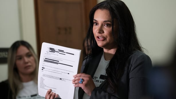 WASHINGTON, DC - MAY 29: Epstein abuse survivors Sharlene Rochard displays a copy of redacted emails as she speaks to the media on Capitol Hill on May 29, 2026 in Washington, DC. The press conference is being held outside of a closed-door House Oversight Committee interview with former U.S. Attorney