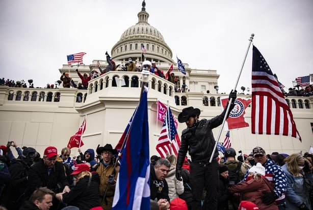 WASHINGTON, DC - JANUARY 06: Pro-Trump supporters storm the US Capitol following a rally with President Donald Trump on January 6, 2021 in Washington, DC. Trump supporters gathered in the nation's capital today to protest the ratification of President-elect Joe Biden's Electoral College victory over