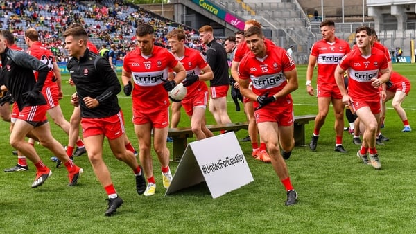 16 July 2023; The Derry squad break away after their team photograph alongside a #UnitedForEquality sign before the GAA Football All-Ireland Senior Championship Semi-Final match between Derry and Kerry at Croke Park in Dublin. Photo by Piaras Ó Mídheach/S