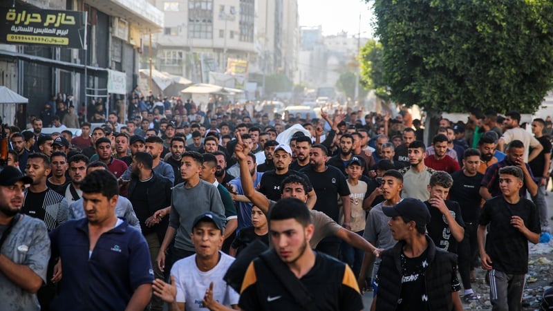 Citizens and relatives of the Palestinian Ahmed Hils attend the funeral ceremony in Gaza city