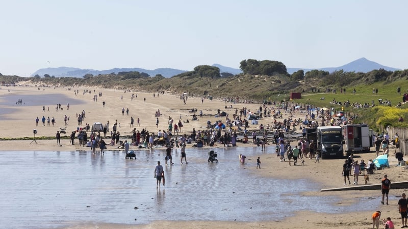Crowds enjoying the sunshine on Portmarnock beach as temperatures reach highs of 23 degrees C.