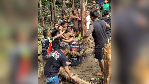 Rescued men are welcomed by crowds after being trapped in a cave in LAos
