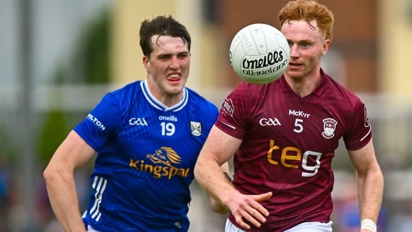 Westmeath's Ronan Wallace in possession with Evan Crowe of Cavan in pursuit