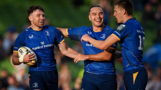 30 May 2026; Hugo Keenan of Leinster, left, celebrates with teammate James Lowe, centre, and Sam Prendergast after scoring their side's second try during the United Rugby Championship quarter-final match between Leinster and Lions at the Aviva Stadium in Dublin. Photo by Brendan Moran/Sportsfile
