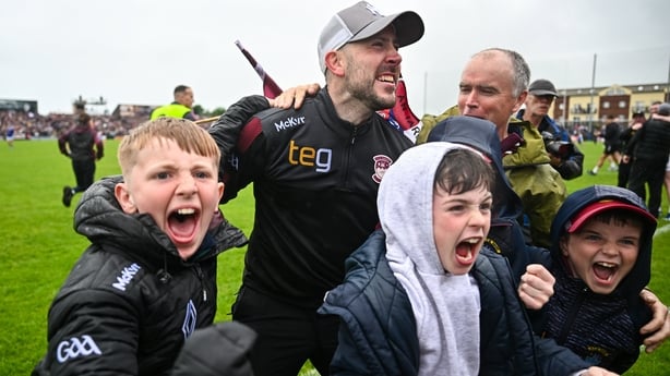 Mark McHugh celebrates with supporters after the full-time whistle