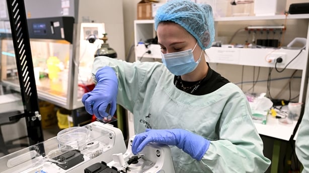In this photo taken on May 5, 2026, research scientist Daria Kornienko places cortical and hippocampal cells on a cell culture plate into a CL1 unit before being placed in server racks and available to study via the internet, at Cortical Labs' Physical Containment Level 2 (PC2) laboratory in Melbour