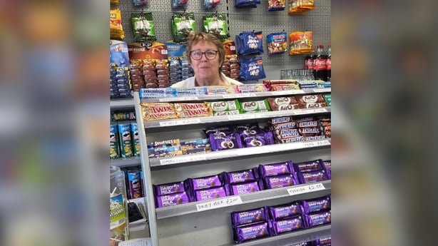 Volunteer Mary Keane behind the counter at An Siopa Beag