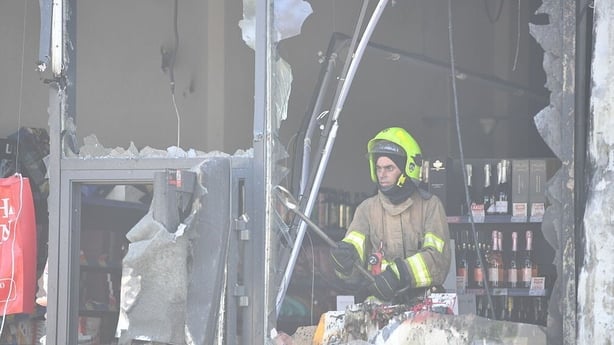 ODESA, UKRAINE - MAY 27: Firefighters work at the site of a Russian drone strike on May 27, 2026 in Odesa, Ukraine. Residential buildings, a Nova Poshta branch and a grocery store were damaged in a Russian drone attack on the Odesa district. Several private vehicles caught fire. Eight people, includ