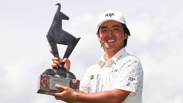 Kato Kaneko poses with the trophy after his victory in Austria
