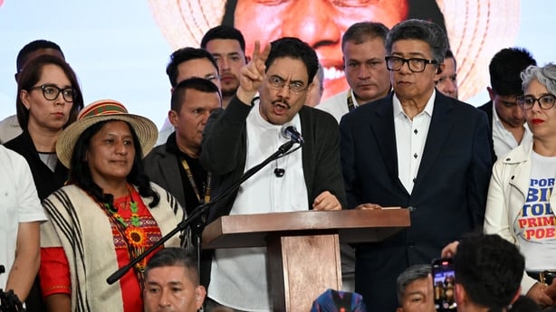 Colombia's presidential candidate from the ruling party Pacto Historico, Ivan Cepeda (C), speaks next to his vice-presidential running mate Aida Quilcue (L) after a quick count of votes in the presidential election at the Tequendama Hotel in Bogota on May 31, 2026. Colombia's presidential election a