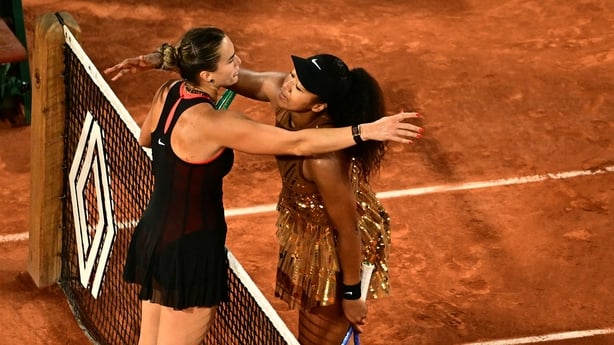 Japan's Naomi Osaka (R) and Aryna Sabalenka (L) embrace at the end of their women's singles match on day 9 of the French Open tennis tournament on Court Philippe-Chatrier at the Roland-Garros Complex in Paris on June 1, 2026. (Photo by JULIEN DE ROSA / AFP)
