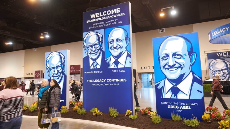 Signage depicting former Berkshire Hathaway CEO Warren Buffet and Berkshire Hathaway CEO Greg Abel in a convention hall