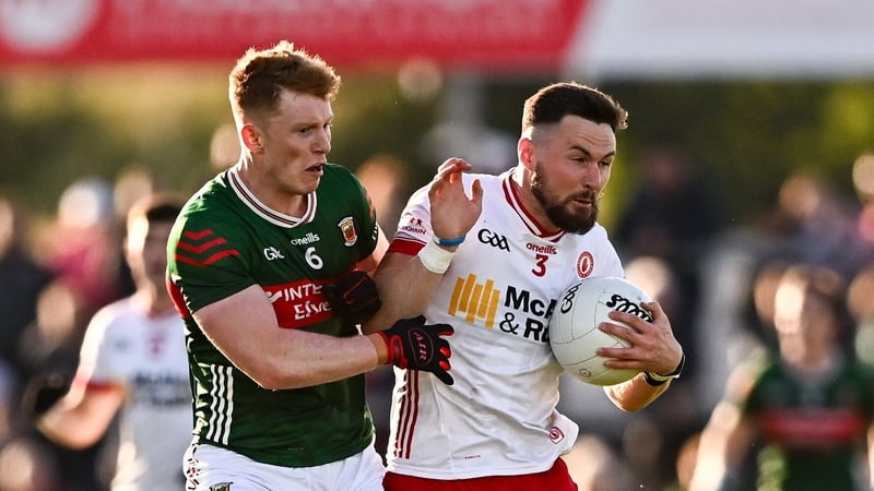 31 May 2025; Peter Teague of Tyrone in action against David McBrien of Mayo during the GAA Football All-Ireland Senior Championship Round 2 match between Tyrone and Mayo at O'Neills Healy Park in Omagh, Tyrone. Photo by Piaras Ó Mídheach/Sportsfile