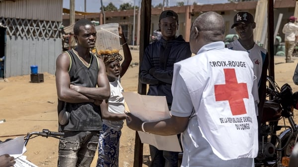 BUNIA, DEMOCRATIC REPUBLIC OF CONGO - JUNE 1 : Residents listen to Congolese Red Cross volunteers during an Ebola awareness campaign on June 1, 2026 in Bunia, Democratic Republic of Congo. Community outreach teams were deployed across affected neighborhoo