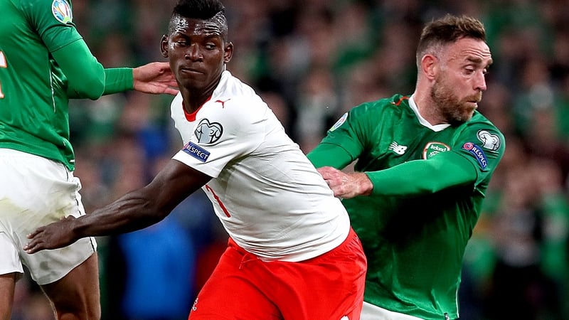 Switzerland's Breel Embolo (centre) and Republic of Ireland's Richard Keogh (right)