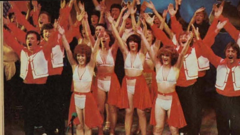 Cropped image of posing performers in red and white outfits, John Player Tops 1991 RTE Guide