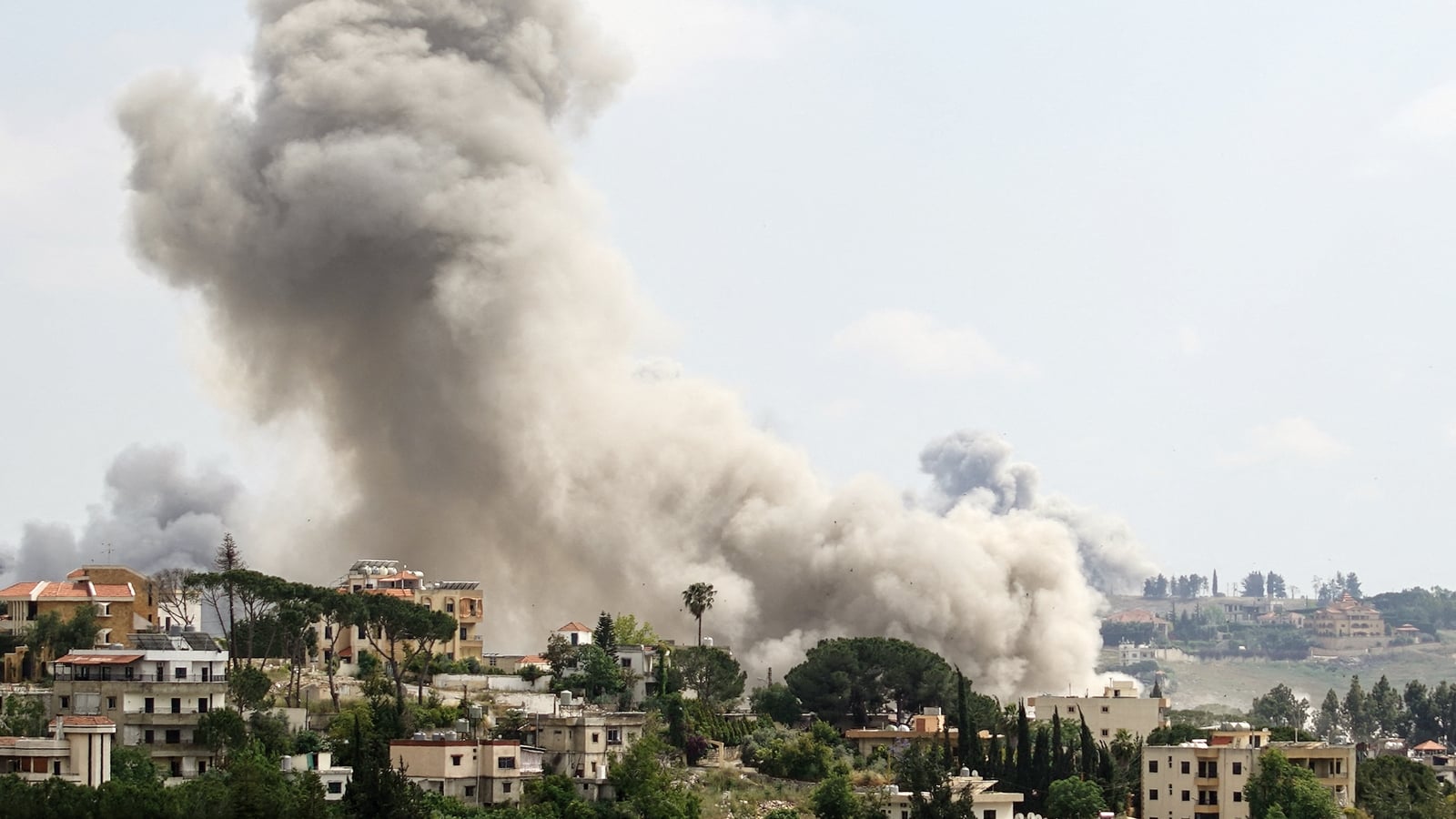 Israel hits south Lebanon, steps back from Beirut attack