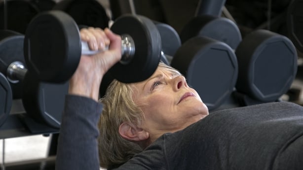 senior woman working out in the gym