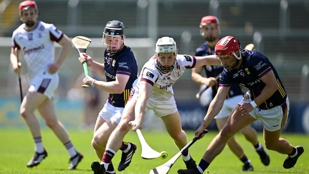 24 May 2026; Joshua Ryan of Galway is tackled by Seán Linnane, left, and Gavin Lee of Galway during the Leinster GAA Senior Hurling Championship Round 5 match between Wexford and Galway at Chadwicks Wexford Park in Wexford. Photo by Ray McManus/Sportsfile