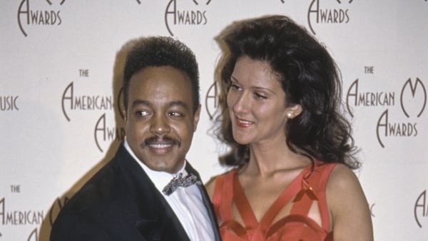 American singer and songwriter Peabo Bryson, wearing a tuxedo and bow tie, and Canadian singer Celine Dion, who wears an orange dress, in the 20th Annual American Music Awards press room at the Shrine Auditorium in Los Angeles, California, 25th January 19
