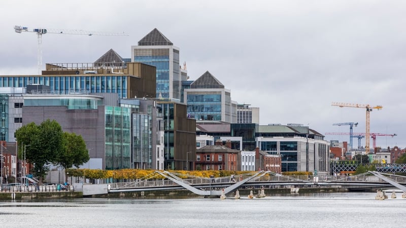 A picture shows the skyline of the business and financial sector of Dublin city centre on October 7, 2021. - The government of Ireland, one of the few countries to have resisted a global minimum tax on multinational firms, will meet on Thursday to decide