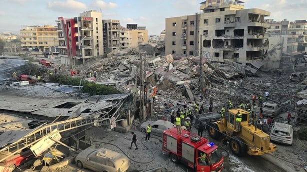 First responders gather at the site of an Israeli strike that hit near a hospital
