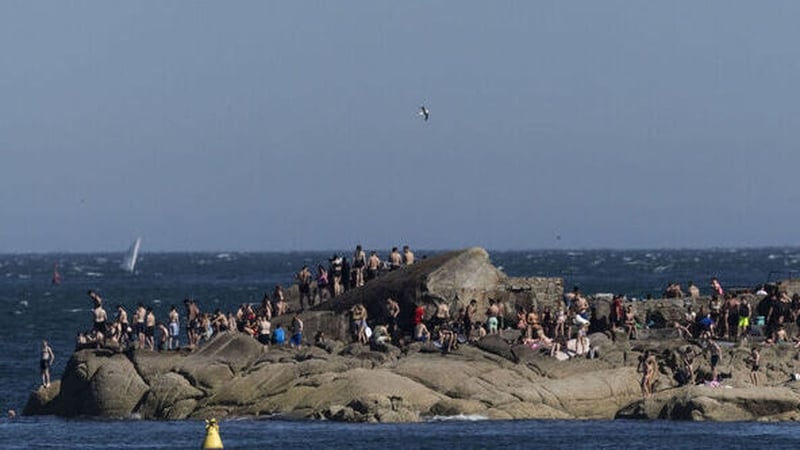 Crowds of people at Sandycove in Dublin during record-breaking heat in May 2026