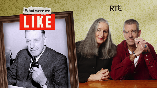 A man and a woman with a picture of Sean Lemass